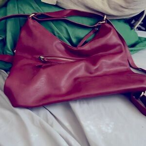 Purse and it is dark red. Leather and it is a Joy Susan purse. No longer want it